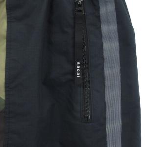sacai × KAWS 21-02568M トラックパンツ ジョガー イージーパンツ 迷彩柄 カモ柄 緑系 グリーン 1 S位