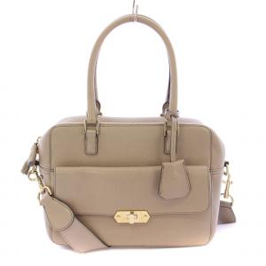 カーカー 2WAY ハンドバッグ ショルダーバッグ レザー ターンロック式 タッセルチャーム グレージュ