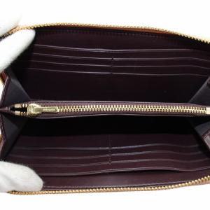 COACH 長財布 レザー ラウンドファスナー シグネチャー エンボス加工 総柄 ロゴ ゴールド金具 ピンク F27865