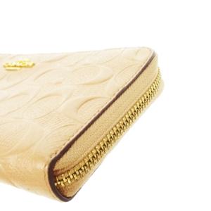 COACH 長財布 ロングウォレット 小銭入れあり ラウンドファスナー レザー 革 エンボス シグネチャー ロゴ ピンクベージュ