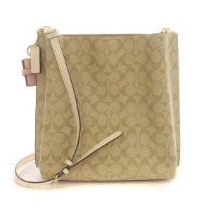 COACH モリー バケット ショルダーバック クロスボディ シグネチャー 斜め掛け ロゴ チャーム付き PVC キャンバス レザー 茶